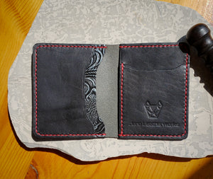 Black bifold wallet with floral pocket